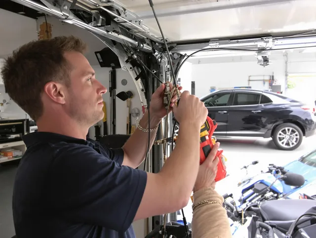 Pickerington Garage Door Repair safety certified technician performing cable replacement in Pickerington