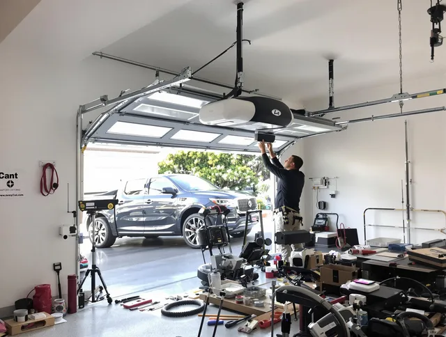 Pickerington Garage Door Repair specialist installing smart garage door opener system in Pickerington home
