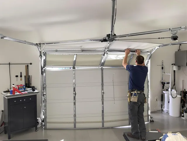 Pickerington Garage Door Repair specialist performing precise section replacement on Pickerington garage door